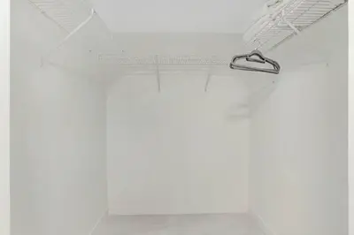 a white room with a hanger hanging from the ceiling at Deluxe 1 BR suite with Pool, Parking, Balcony and Ocean Views in Miami
