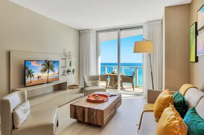 a living room with a view of the ocean at Ocean View Balcony, Beachfront Resort, Pools, Gym in Hollywood