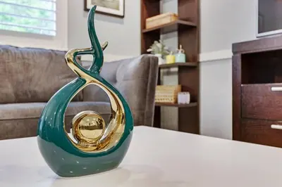 a green glass vase sitting on top of a table at Modern 2BRHouse in Wilton Manors with a Heated Pool and KING Bed in Fort Lauderdale