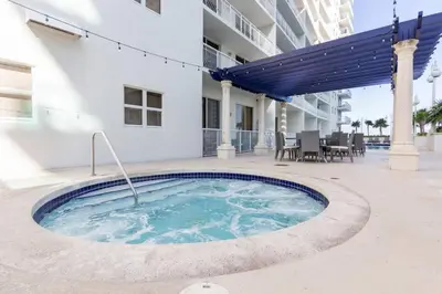 a swimming pool in the middle of a building at LuxBright 1BR Brickell Paradise with Oceanview and Parking in Miami