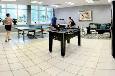 a room with ping pong tables and ping pong balls at Ocean and City Views Lux Miami Brickell Sleeps 5 in Miami