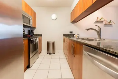 a kitchen with a sink and a counter top at Ocean and City Views Lux Miami Brickell Sleeps 5 in Miami