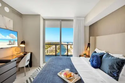 a bedroom with a bed with a view of the ocean at High Floor with Stunning Views, Amazing Pools in Hollywood