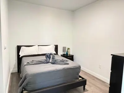 a bedroom with a bed in a room at Modern Miami Retreat, Hot Tub and Gazebo Oasis in Miami