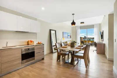 a kitchen and dining room with a table and chairs at Front Bay View Terrace Amazing Pool in Hollywood