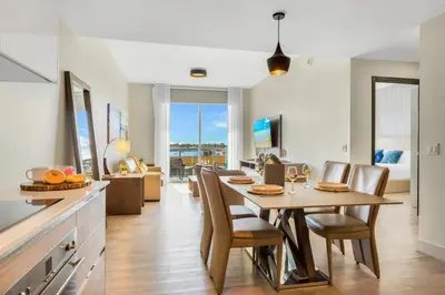 a kitchen and dining room with a table and chairs at Front Bay View Terrace Amazing Pool in Hollywood