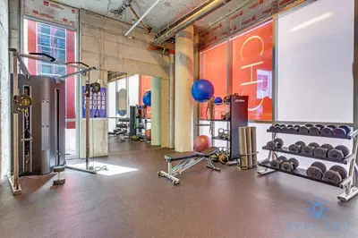 a gym with dumbbells and weights in a room at Front Bay View Terrace Amazing Pool in Hollywood