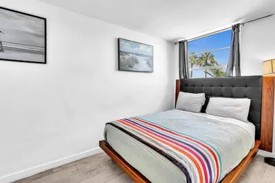 a bedroom with a bed and a window at Deluxe modern 1 bedroom in south beach in Miami Beach
