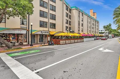 an empty street with umbrellas on the side of a building at Deluxe modern 1 bedroom in south beach in Miami Beach