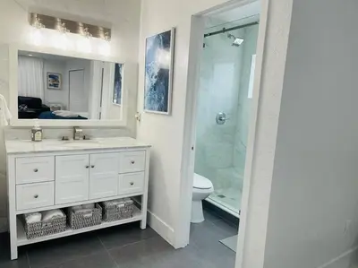 a bathroom with a shower and a sink and a toilet at Home in Miami in Miami