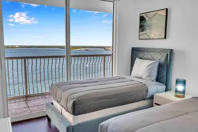 a bedroom with two beds and a large window at Central ocean view 3 bedrooms in Miami W Parking in Miami