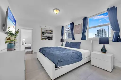 a bedroom with a bed and a large window at Iconic High floor 3 bedrooms in the heart of Miami in Miami