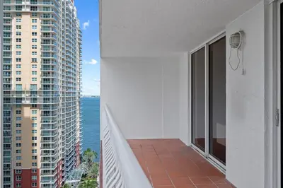 a balcony of a building with a view of the ocean at Superb unit, centrally located with parking in Miami