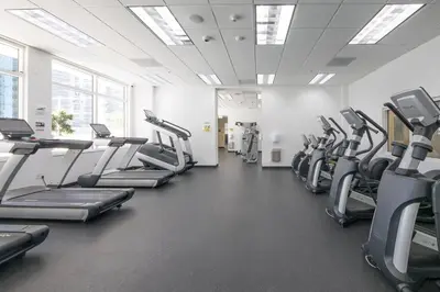 a gym with treadmills and elliptical machines at Superb unit, centrally located with parking in Miami