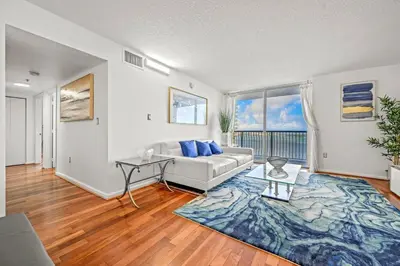 a living room with a couch and a table at Spacious Ocean view unit in the heart of Brickell in Miami