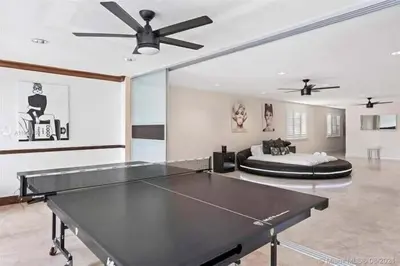 a living room with a ping pong table and a bed at Hollywood Luxurious Waterfall Villa with Incredible views in Hollywood