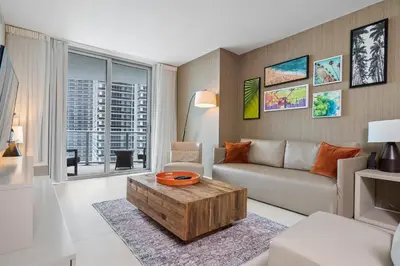 a living room with a couch and a coffee table at 15th-Floor Luxury 1BR at Lyfe Resort with Ocean View in Hollywood