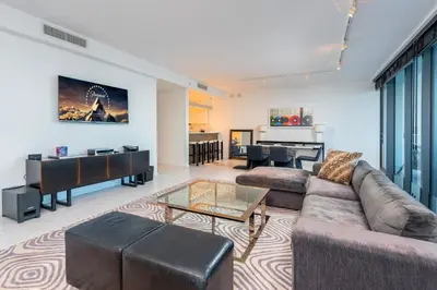 a living room with a couch and a table at Oceanfront Private Residence at South Beach - 828 in Miami Beach
