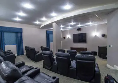 a conference room with leather chairs and a flat screen tv at Miami Hollywood Gorgeous 2BD Awesome Ocean View in Hollywood