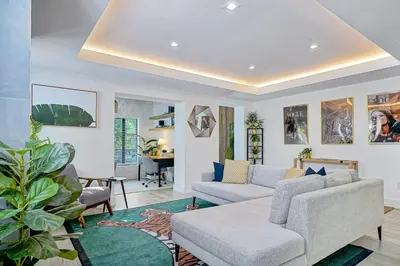 a living room with a couch and a table at Villa Verde Miami in Miami