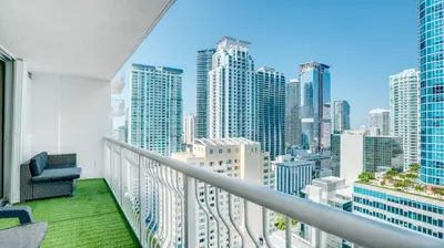 a balcony with a view of a city skyline at Warm and Tailored 1BR w Pool Hot tub GYM Parking in Miami