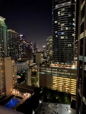 a view of a city skyline at night at Warm and Tailored 1BR w Pool Hot tub GYM Parking in Miami