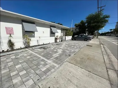 a car parked in a parking lot next to a building at Great Apartment 2 BR near the beach in Miami