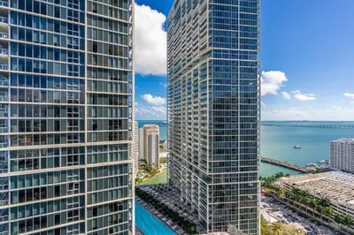 an aerial view of two tall skyscrapers in a city at Luxurious Condo at ICON with Views in Miami
