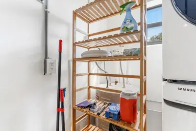a wooden shelf in a room with baseball equipment at Lauderdale Modern 1 Bedroom 1 Bathroom with Private Backyard in Fort Lauderdale