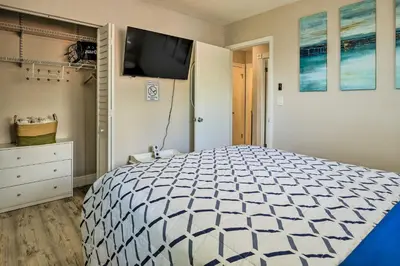 a bedroom with a bed and a flat screen tv at Gated Southern Miami Home 22 Mi to Downtown! in Miami