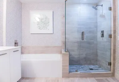 a bathroom with a shower with a glass door at Brickell House Dreams - Luxury Stay and Amenities in Miami