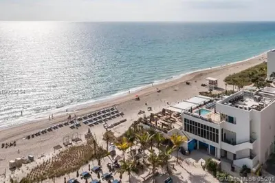 an aerial view of a beach and a building at Beautiful penthouse condo with stunning views of both ocean and city in Hollywood