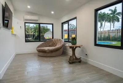 a living room with a chair and a table at Welcome to 305 Rentals in Miami
