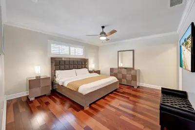 a bedroom with a bed and a ceiling fan at Premium Luxury 5BR Villa near Hollywood Beach in Hollywood
