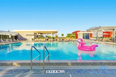 a swimming pool with a pink flamingo in the water at Front Bay View Terrace Rooftop Pool Near Beach in Hollywood