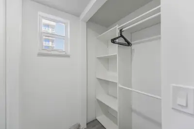 a white room with a shelf and a window at Beachfront Getaway Studio with Parking - M21 in Hollywood