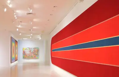 an art gallery with a red and blue wall at Las Olas 1BR Pool Free Parking Ideal for 2 in Fort Lauderdale