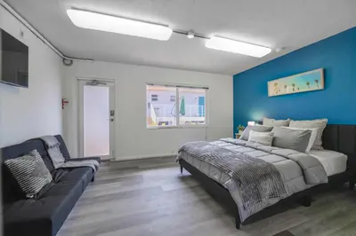 a bedroom with a bed and a couch at The mariner Suites #22 - Beachfront Studio in Hollywood