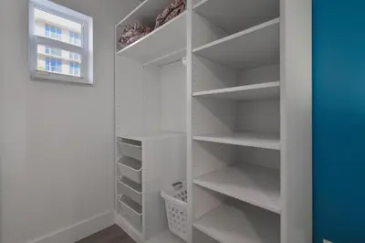 a walk in closet with white shelves and a window at Hollywood Beach Retreat Studio - M23 in Hollywood