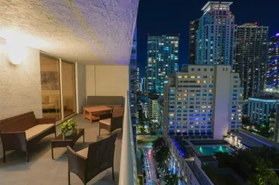 a balcony with a view of a city at night at City & Sea View+FREE Parking Modern Condo in Miami
