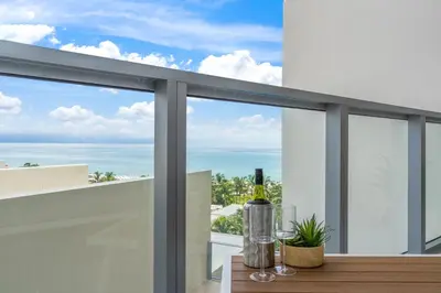 a view of the ocean from the balcony of a house at Private Residence at South Beach - 811 in Miami Beach