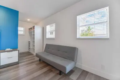a living room with a couch and a window at Wonderful Studio with pool and parking at the beach! M31 in Hollywood