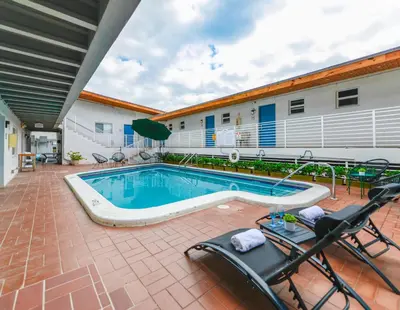 a swimming pool in front of a building at Fantastic Studio at the Beach with Parking&Pool - M43 in Hollywood