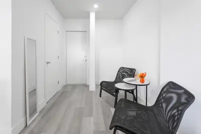 a room with two chairs and a table and a door at Fantastic Studio at the Beach with Parking&Pool - M43 in Hollywood
