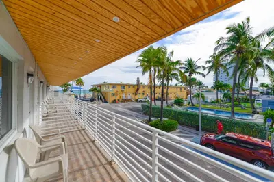 a balcony with chairs and a view of a street at Unit with Balcony and Parking at the beach -M45 in Hollywood