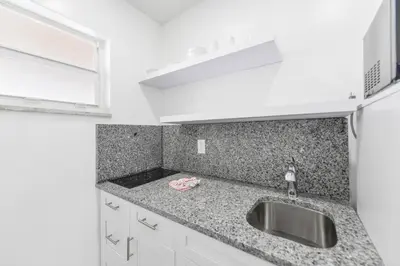 a kitchen with a sink and a counter top at Unit with Balcony and Parking at the beach -M45 in Hollywood