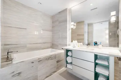 a white bathroom with a tub and a sink at OceanView Private Residence at South Beach -1614 in Miami Beach