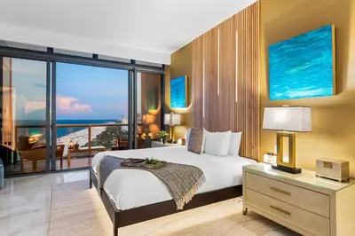 a bedroom with a bed and a view of the ocean at PENTHOUSE Ocean View Residence at South Beach - 1926 in Miami Beach