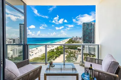a room with a view of the beach and ocean at PENTHOUSE Ocean View Residence at South Beach - 1926 in Miami Beach