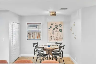 a dining room with a table and chairs at Pool Heat I Firepit and BBQ I 75